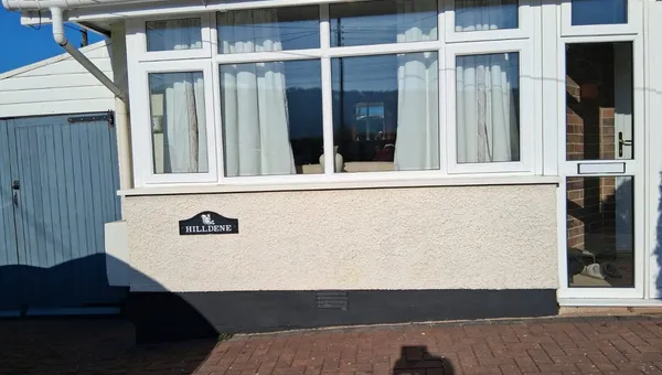 Bungalow with newly installed white UPVC windows and front door
