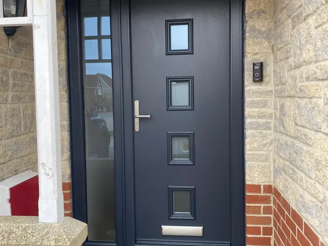 After: Tired timber front door upgraded to an anthracite composite door with matching side panel.