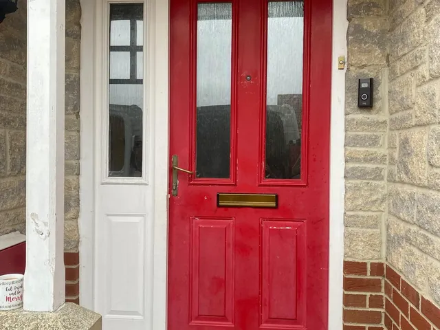 Before: Tired timber front door upgraded to an anthracite composite door with matching side panel.