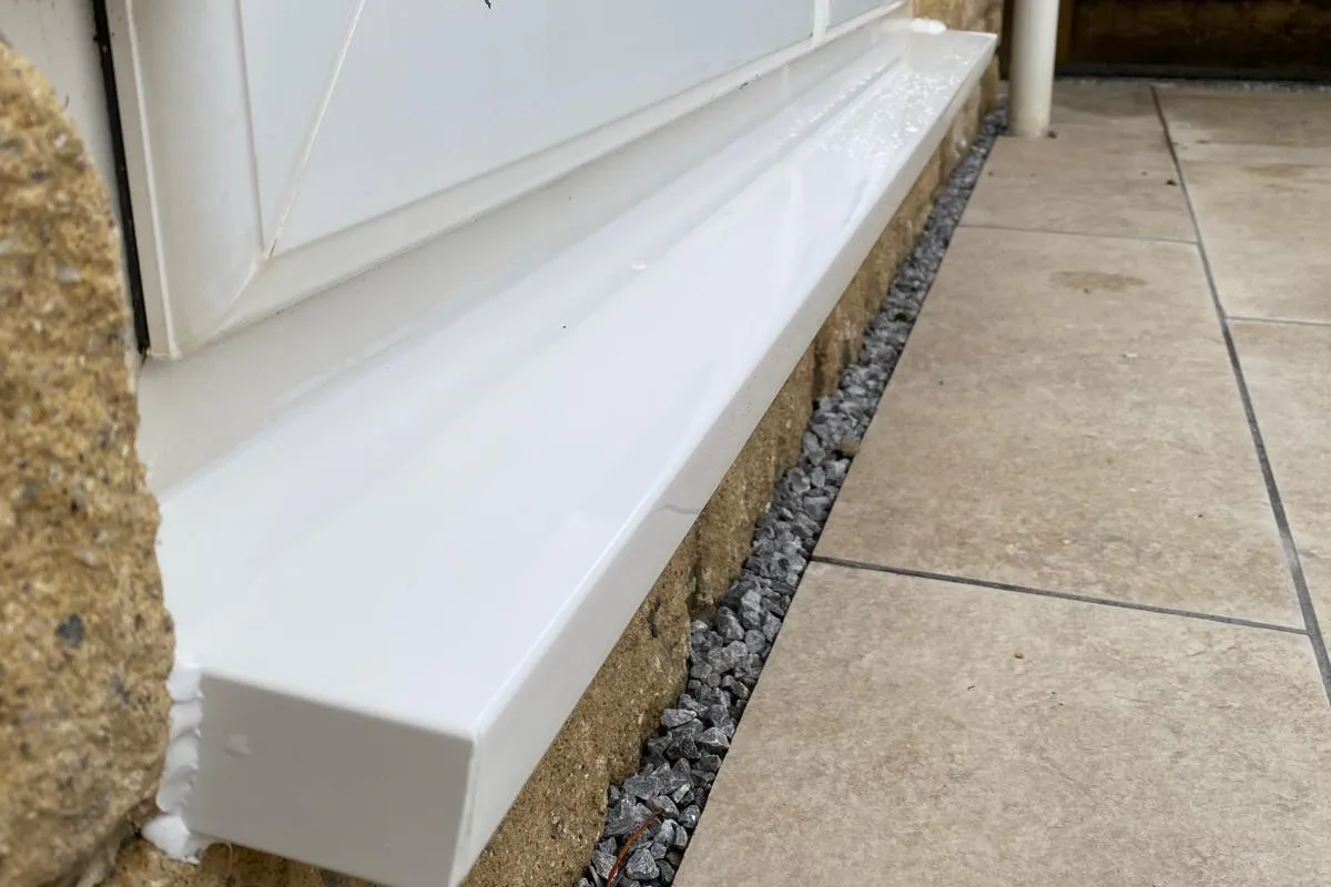 New external window sill neatly fitted and sealed by Window And Door Doctor