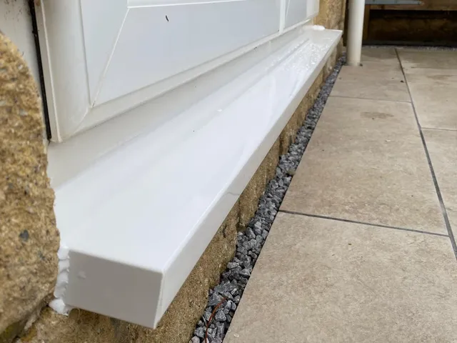 After: Damaged external sill re-capped and resealed: a neat repair, no new window needed.