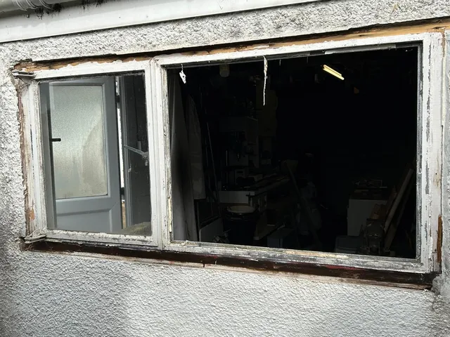 Before: Failed workshop window stripped out and renewed with an energy-efficient UPVC unit.
